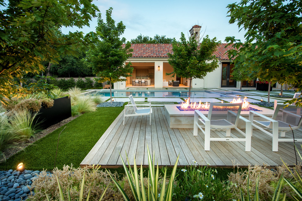 Design ideas for a large mediterranean back terrace in Dallas with a fire feature and no cover.