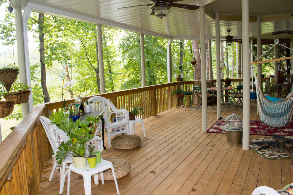 Deck - large traditional backyard deck idea in Atlanta with a roof extension