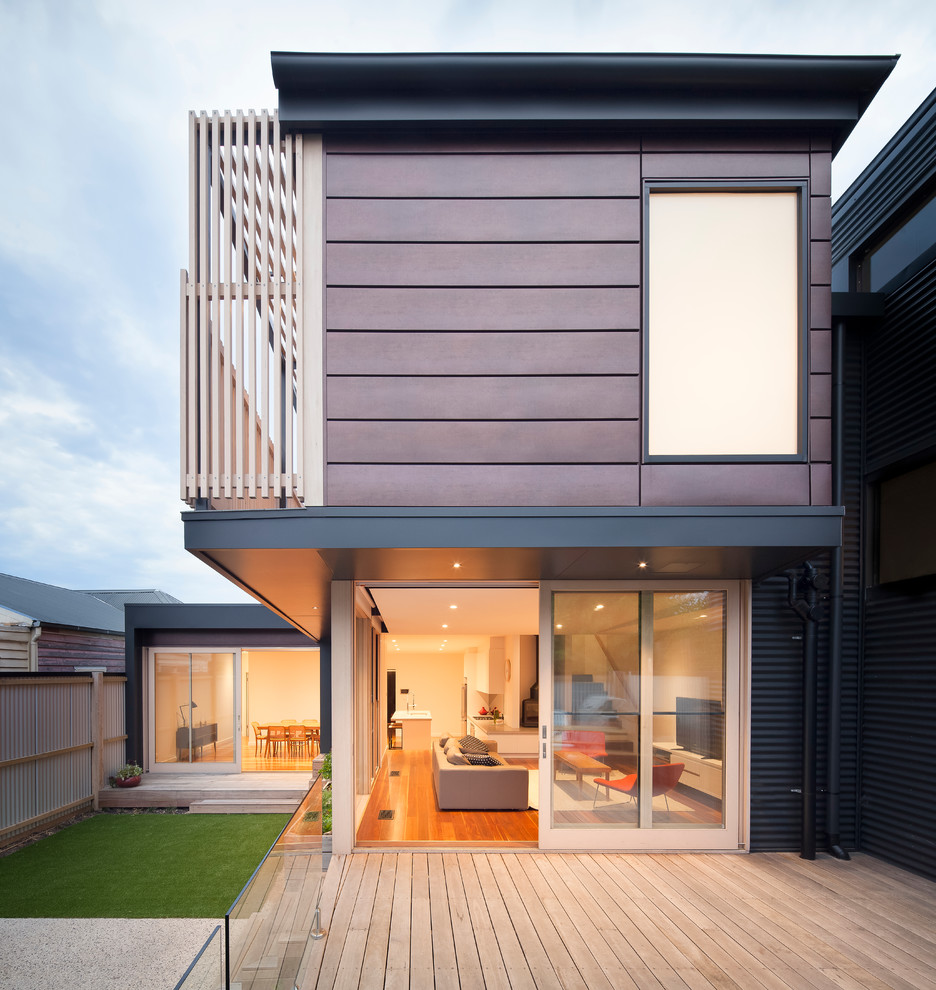 This is an example of a medium sized contemporary back terrace in Melbourne with no cover.