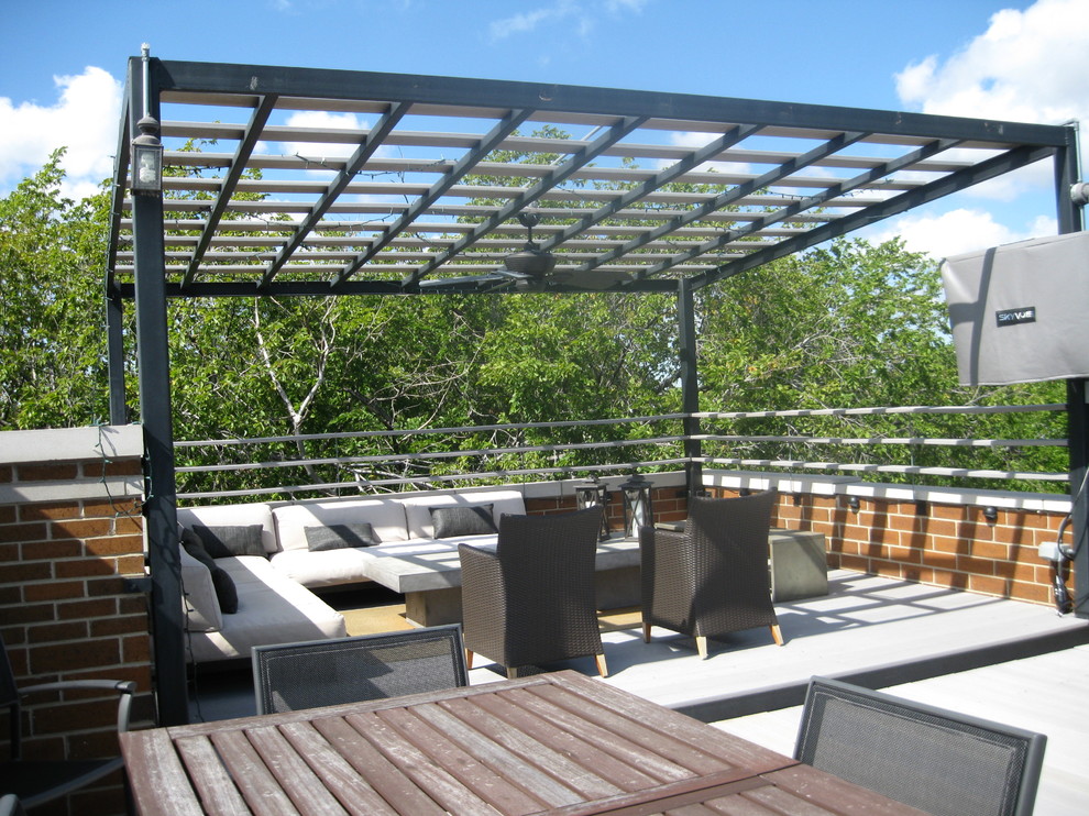Photo of a large modern roof terrace in Chicago with a pergola.