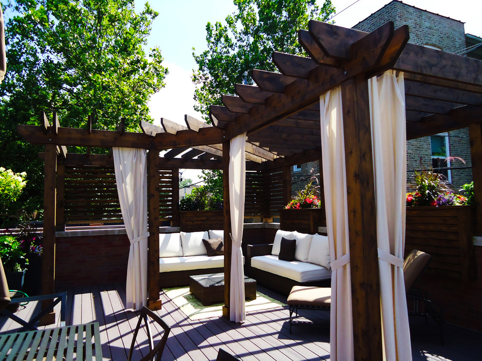 Photo of a small contemporary roof terrace in Chicago with a fire feature and a pergola.