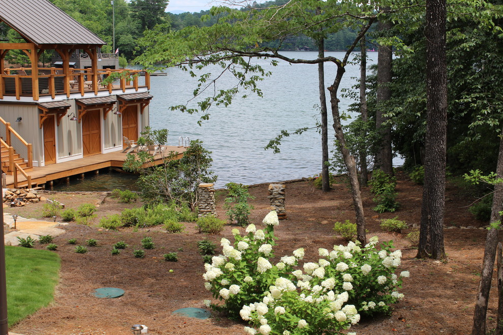 Expansive classic back terrace in Atlanta with a dock and an awning.
