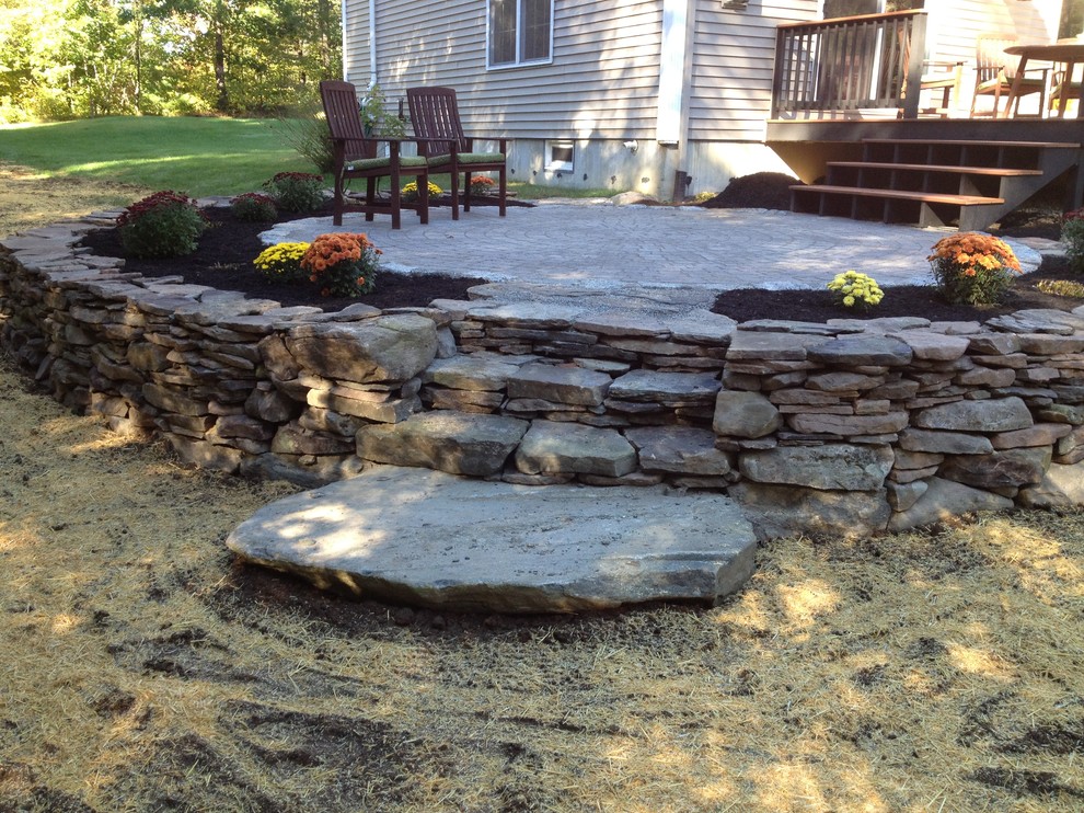 Cicular Patio with Stacked Stone Edging and Deck - Rustic ...