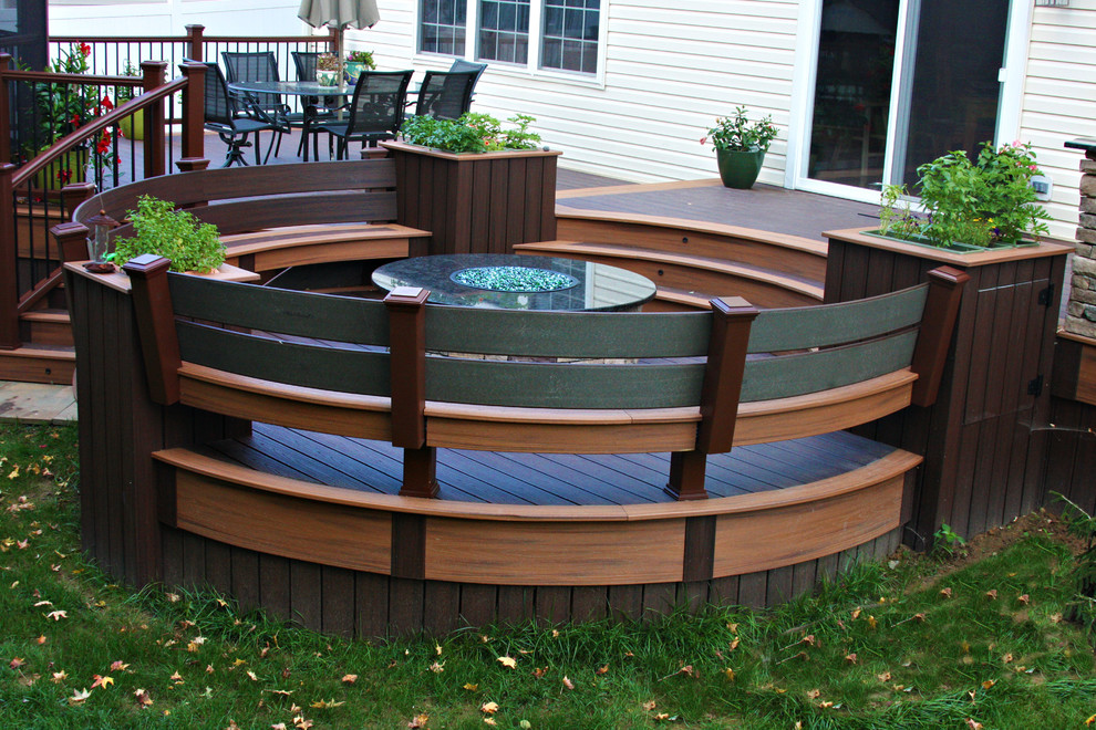 Mid-sized trendy backyard deck photo in Philadelphia with a fire pit and a roof extension