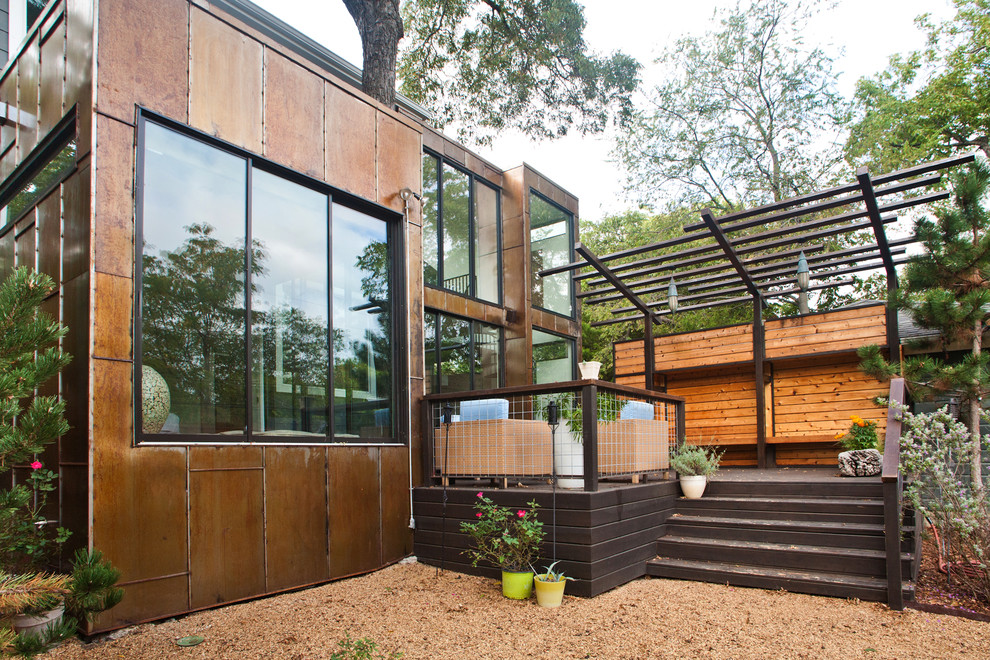 Mid-sized minimalist backyard deck photo in Dallas with a pergola