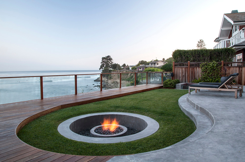 Example of a large transitional backyard deck design in San Francisco with no cover