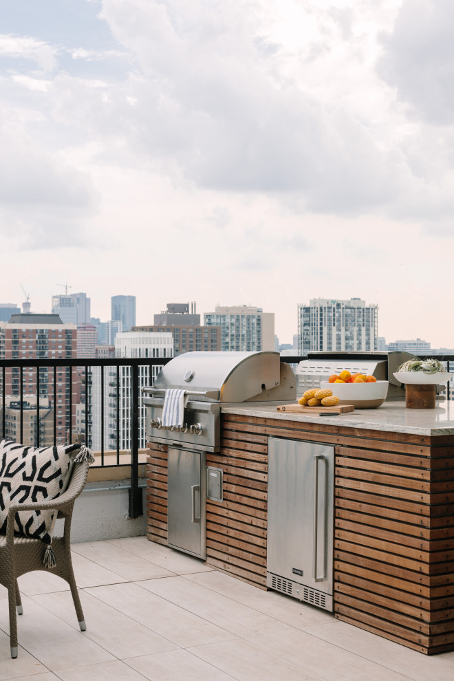 Inspiration for a contemporary rooftop metal railing deck remodel in Chicago with no cover