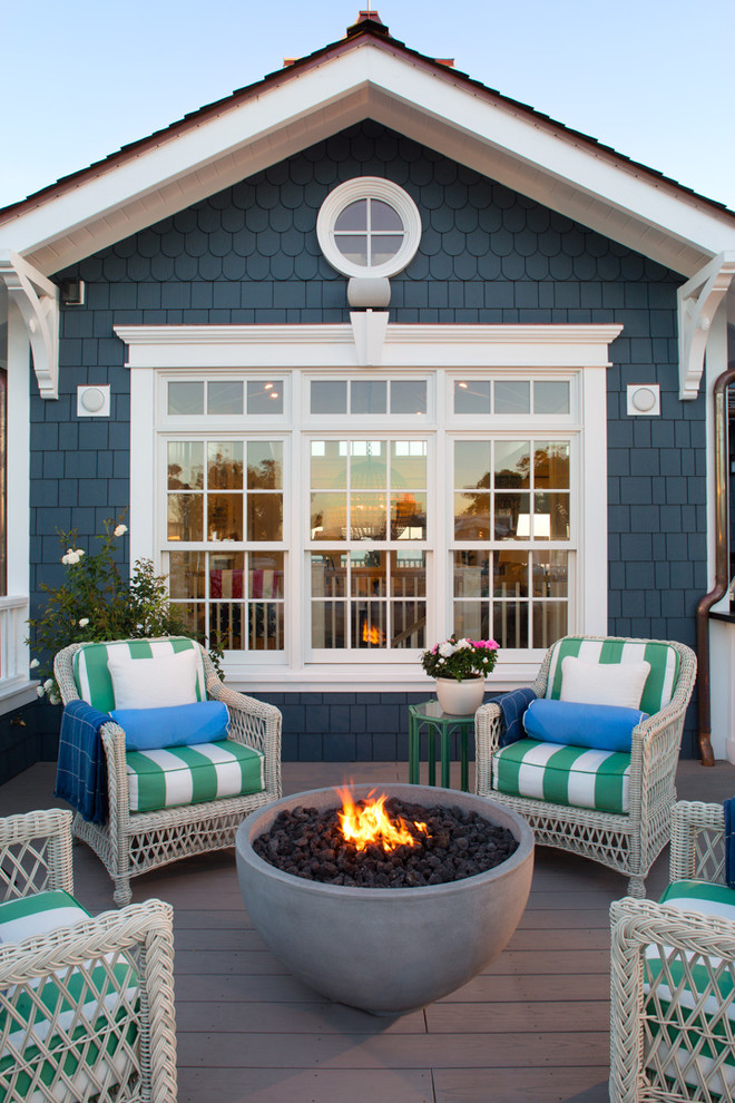 Inspiration for a coastal rooftop rooftop deck remodel in San Diego with a fire pit and no cover