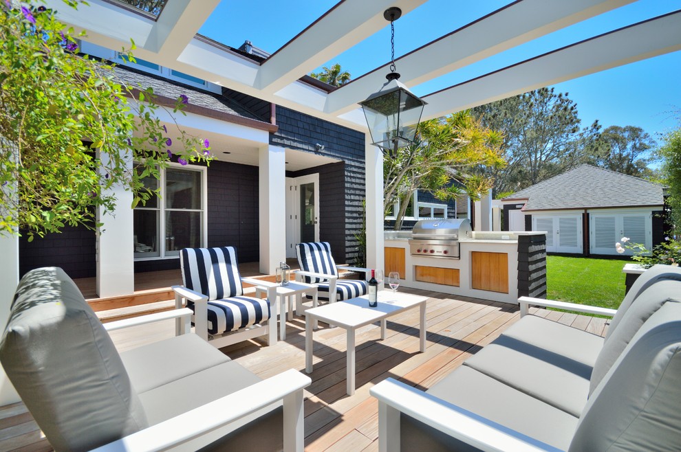 Inspiration for a medium sized traditional back terrace in San Diego with an outdoor kitchen and a pergola.