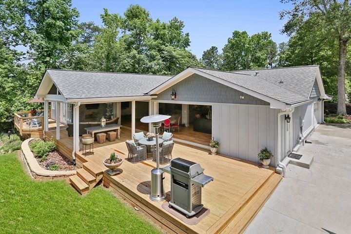 This is an example of an expansive traditional back terrace in Atlanta with no cover.