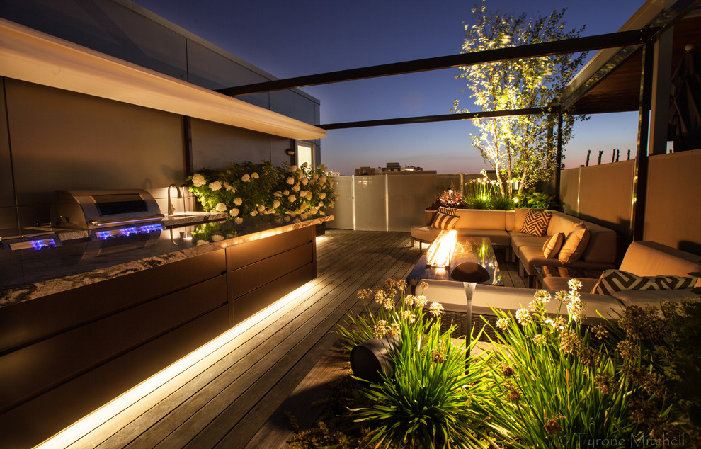 Mid-sized trendy rooftop outdoor kitchen deck photo in Chicago with a pergola