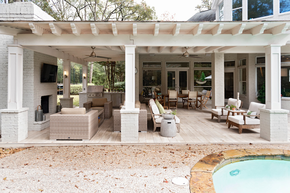 Inspiration for a medium sized modern back terrace in Houston with an outdoor kitchen and a pergola.