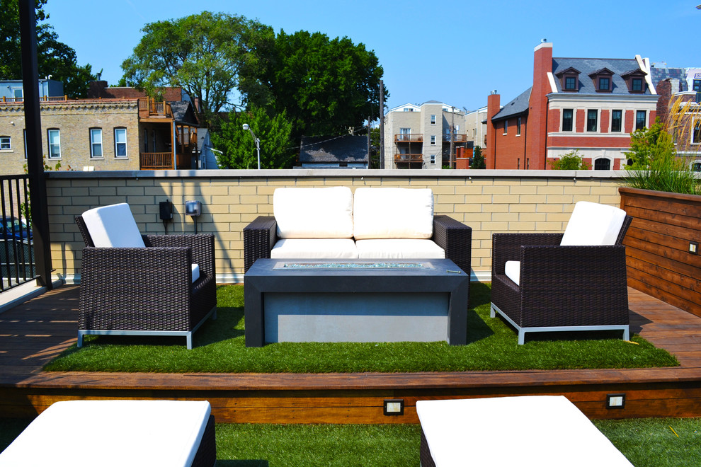 Photo of a medium sized contemporary roof terrace in Chicago with a fire feature and no cover.