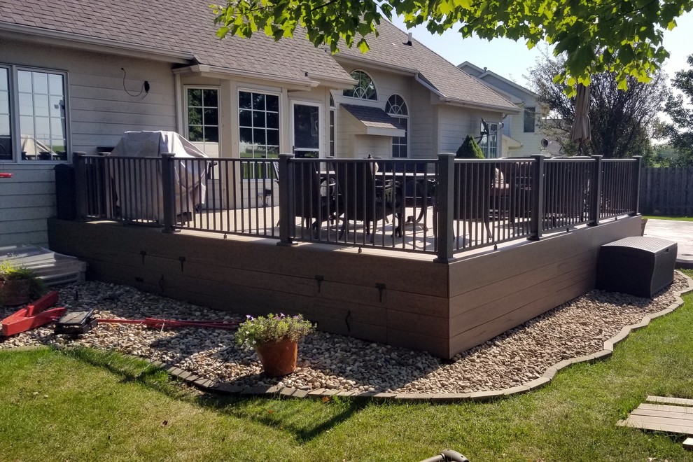 Example of a large backyard deck skirting design in Other with no cover