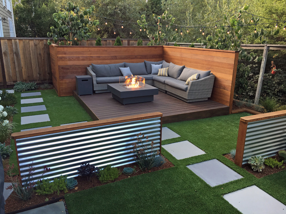 This is an example of a small contemporary back terrace in San Francisco with a fire feature.