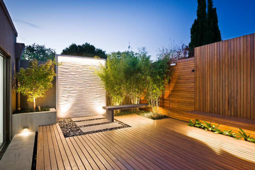 Inspiration for a contemporary backyard water fountain deck remodel in Sydney with no cover