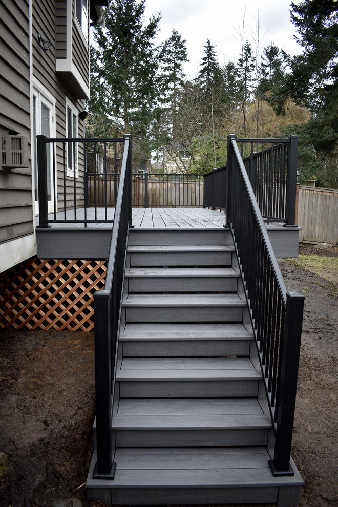 Inspiration for a mid-sized transitional backyard deck remodel in Seattle with no cover