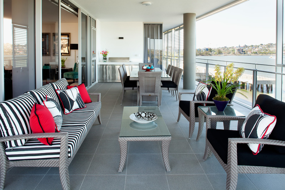 Inspiration for a contemporary terrace in Brisbane with a roof extension and a bbq area.
