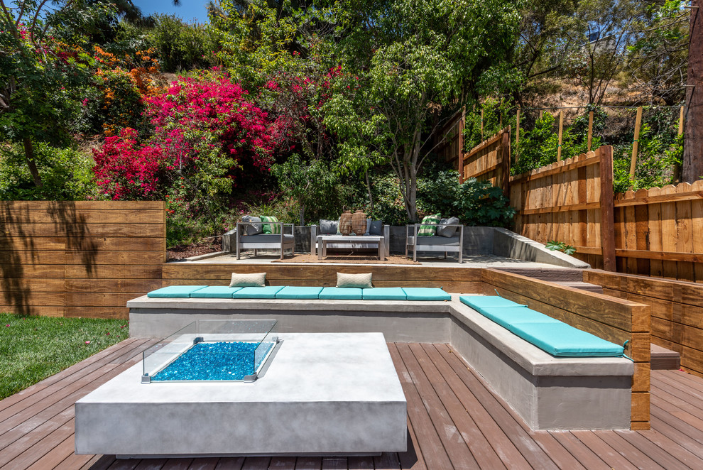 Photo of a contemporary back terrace in Los Angeles with a fire feature and no cover.