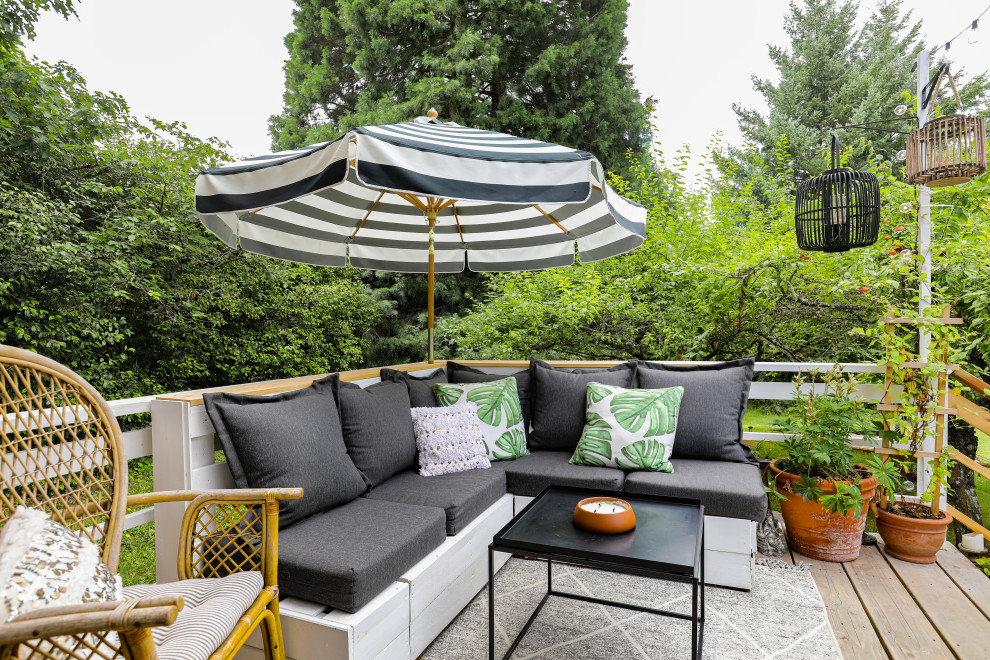 Example of a country deck container garden design in Portland with no cover