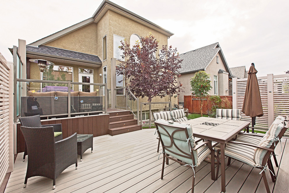 Large traditional back terrace in Calgary with no cover.