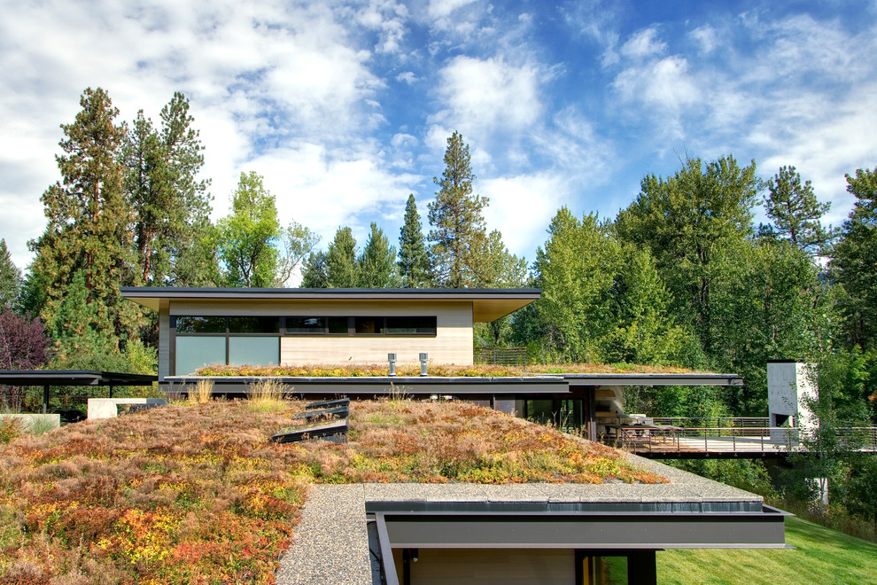 This is an example of a large contemporary roof terrace in Seattle with a roof extension.