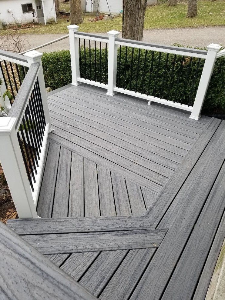 Inspiration for a large modern backyard deck remodel in Grand Rapids with no cover