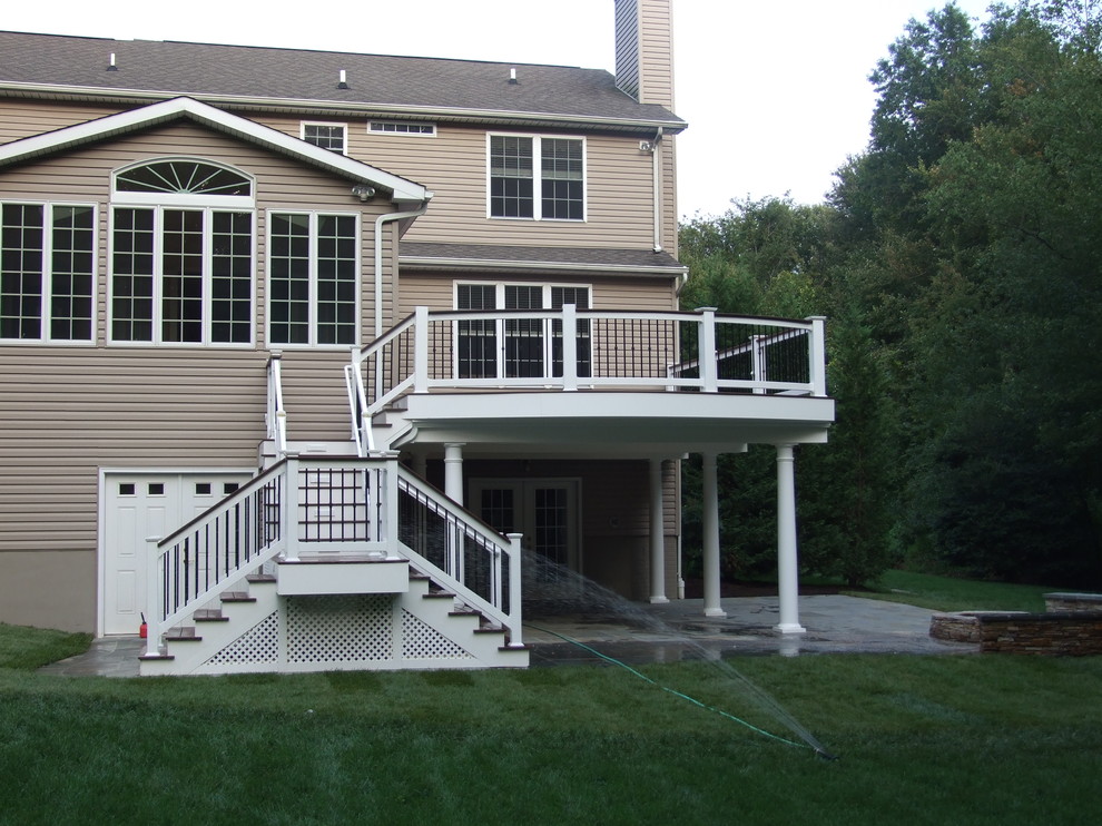 Inspiration for a large transitional backyard deck remodel in Baltimore with no cover