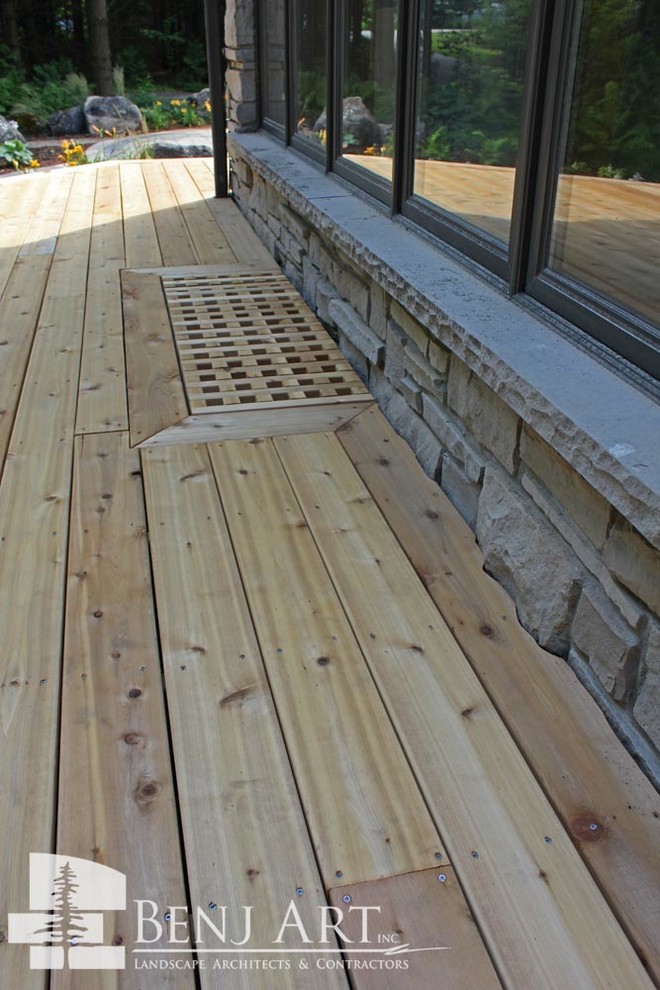 Inspiration for a large rustic backyard deck remodel in Toronto with no cover