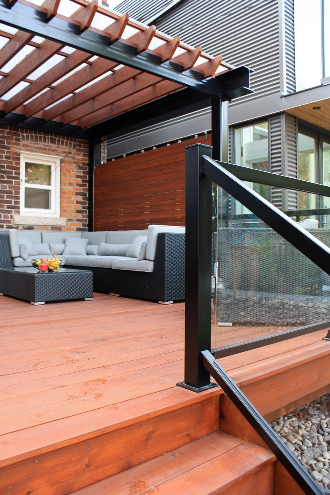 Inspiration for a contemporary terrace in Toronto with a pergola.