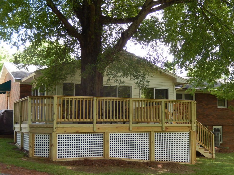 Custom Deck Addition Featuring Square White Vinyl Lattice Traditional