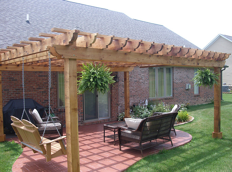 Deck - mid-sized backyard deck idea in Houston with a pergola