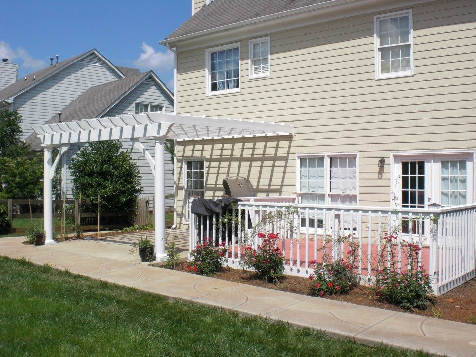 Inspiration for a mid-sized craftsman backyard deck remodel in Charlotte with a pergola
