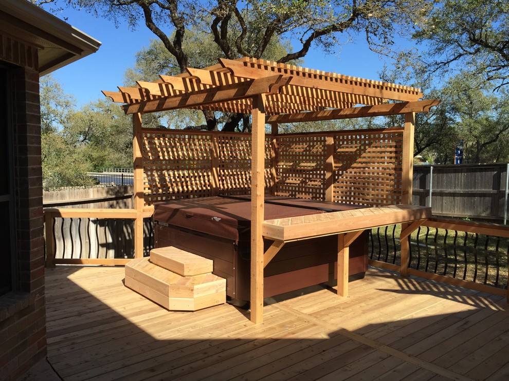 Mid-sized elegant backyard deck photo in Austin with a pergola