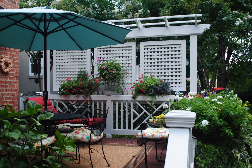 Deck - eclectic backyard deck idea in Other