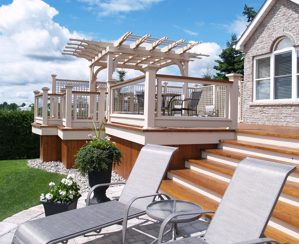 Design ideas for an expansive contemporary back terrace in Toronto with a pergola.