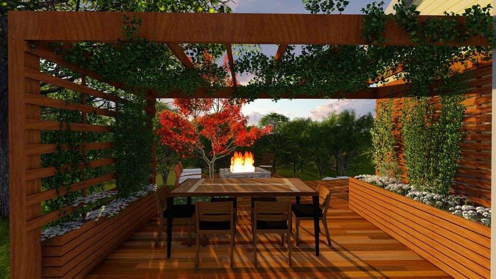 Cette image montre une terrasse arrière design de taille moyenne avec un foyer extérieur et une pergola.