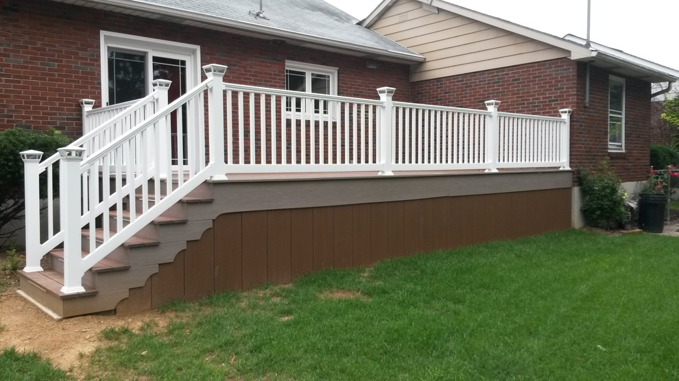 Example of a large classic backyard deck design in Philadelphia with no cover