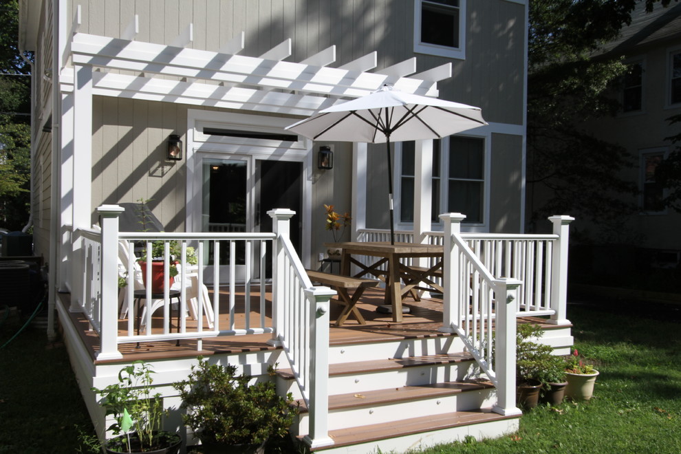 Inspiration for a mid-sized transitional backyard deck remodel in DC Metro with a pergola