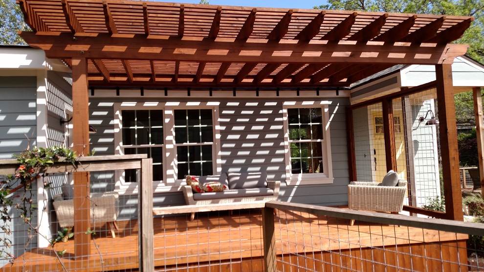 Inspiration for a small craftsman deck remodel in Austin with a pergola