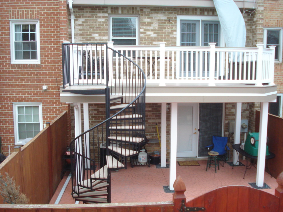 Example of a mid-sized classic backyard deck design in Baltimore with no cover