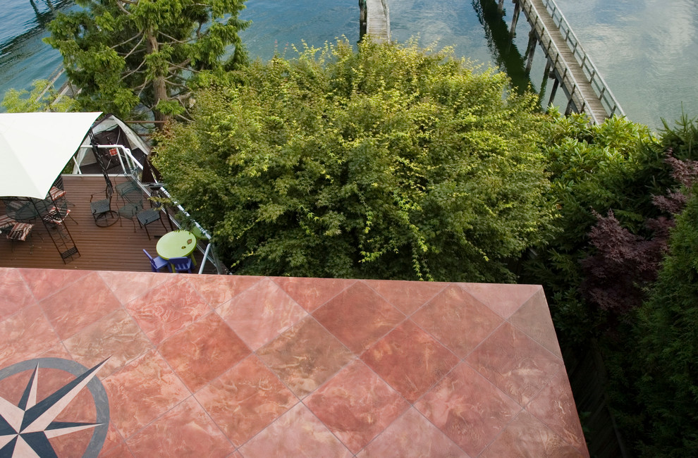 Mid-sized elegant backyard deck photo in Vancouver