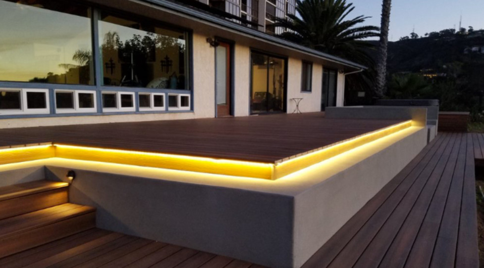 This is an example of a medium sized modern back terrace in Orange County with a fire feature and no cover.