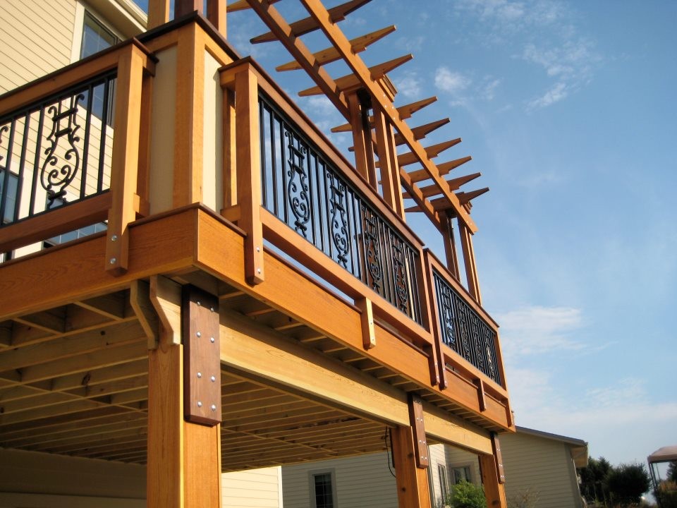 This is an example of a medium sized traditional side terrace in Milwaukee with a pergola.