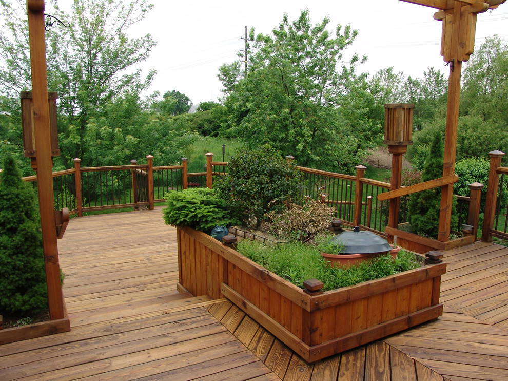 Deck - large traditional backyard deck idea in Grand Rapids