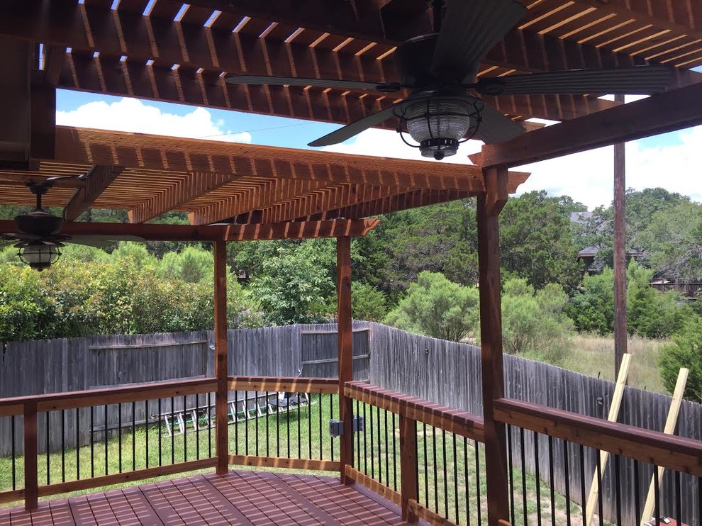 Design ideas for a large traditional back terrace in Austin with a pergola.