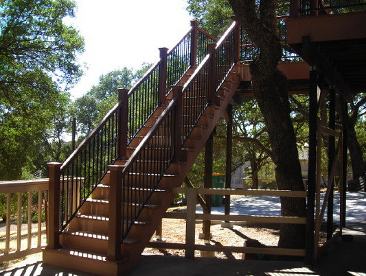 Example of a mid-sized backyard deck design in Sacramento with no cover