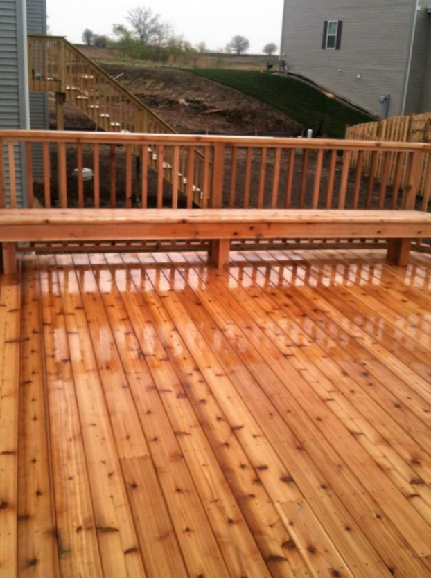 Example of a mid-sized transitional backyard deck design in Chicago with no cover