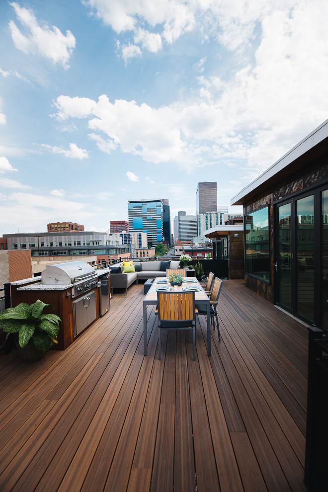 Deck - mid-sized contemporary rooftop rooftop deck idea in Other with a fire pit