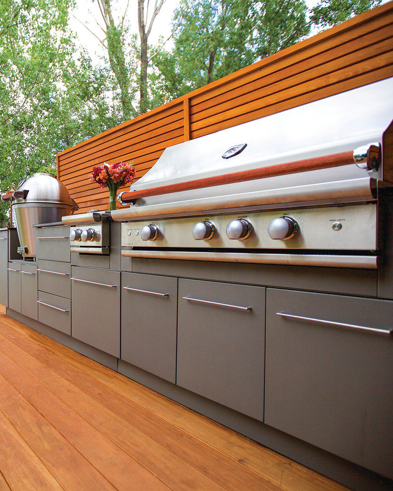 Inspiration for a medium sized contemporary back terrace in Montreal with an outdoor kitchen and no cover.